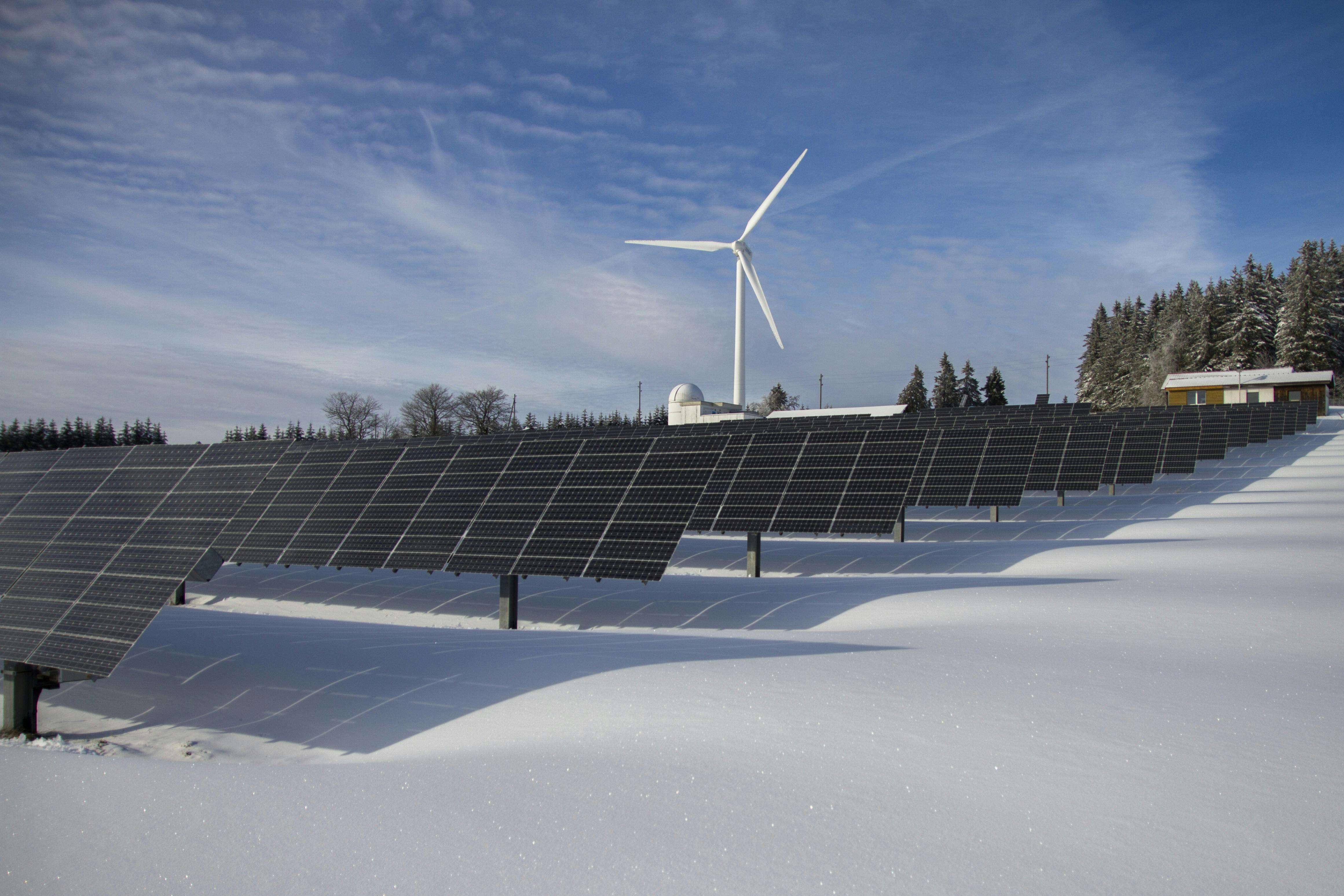 Modern Clean energy sources like solar panels and wind turbines generating renewable power